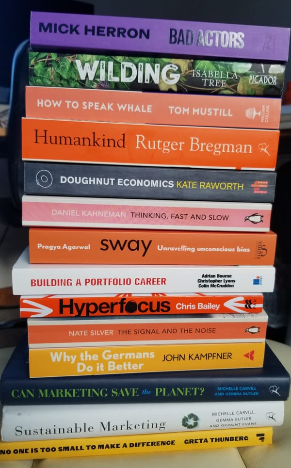 Books on sustainability, self-development and fiction on the bookshelf of Gary Spinks